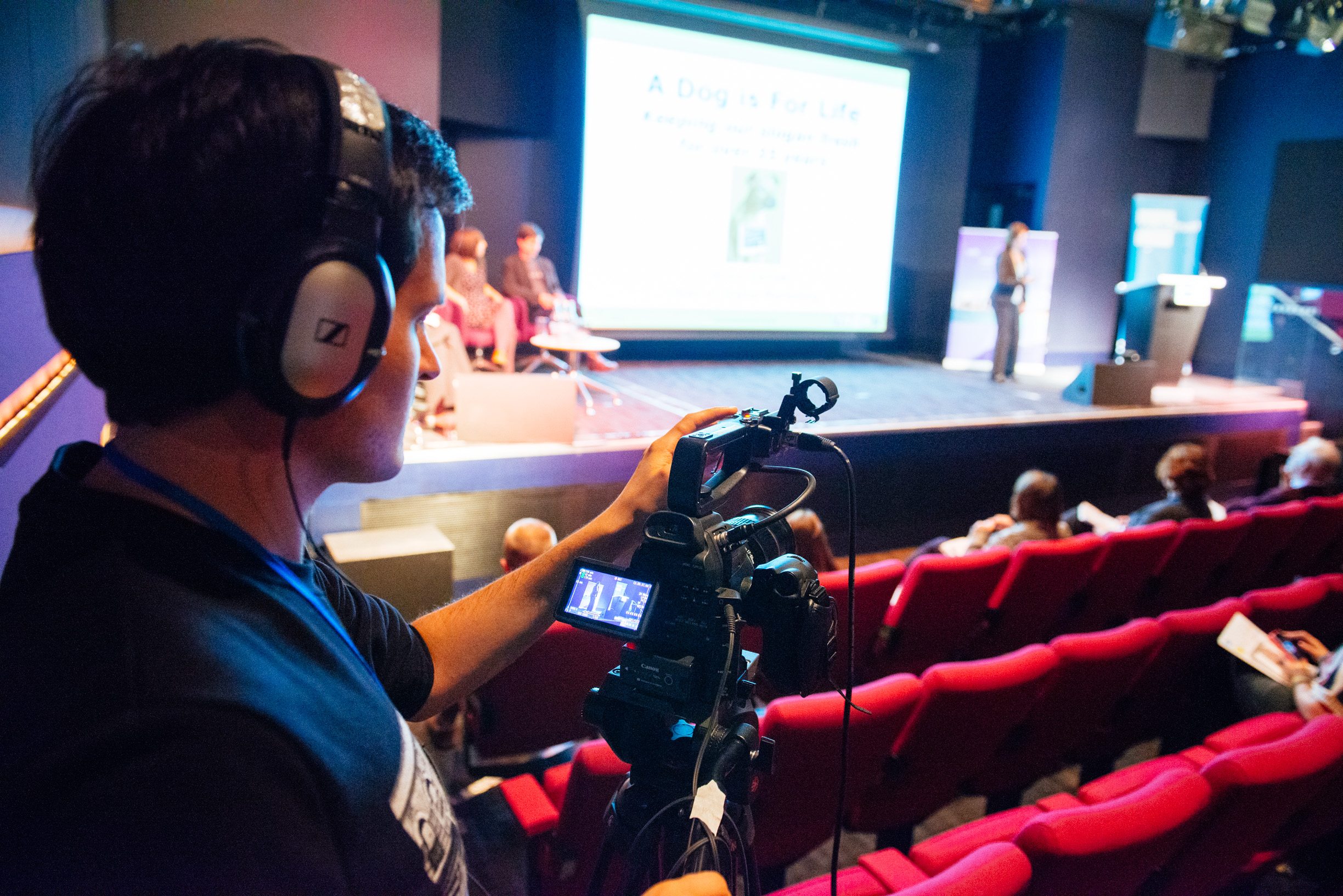 Cameraman filming at a conference