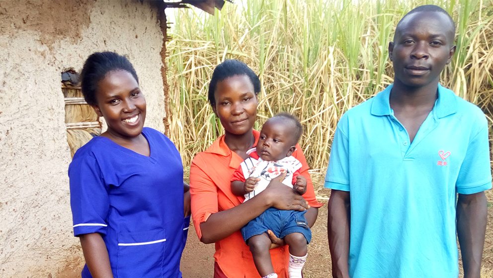 Jr. midwife Aziza with parents of baby Nelson in Uganda