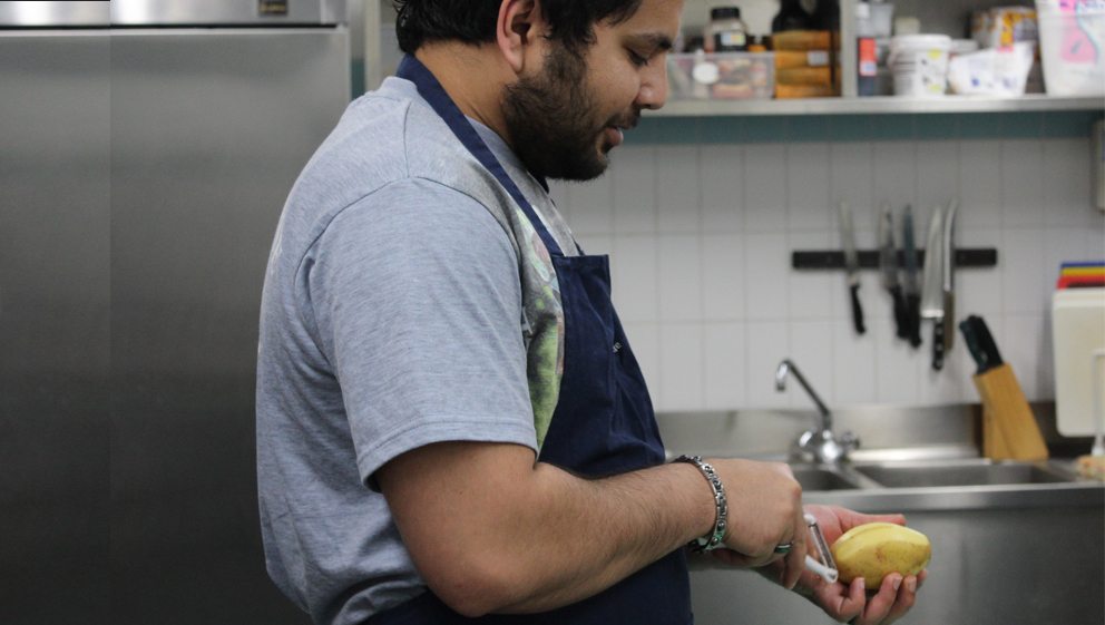 Nick from the COOK project peeling a potato