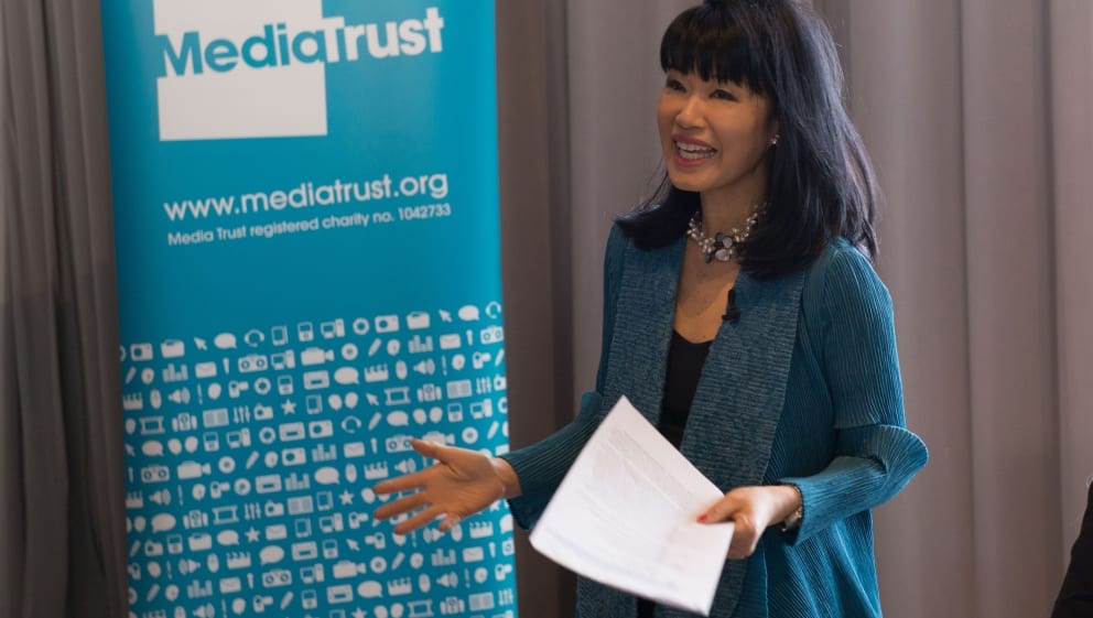 Media Trust CEO Su-Mei Thompsons stands up to kick off the discussion.