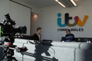 Ollie sitting with his ITV News mentor at ITV News Wales.
