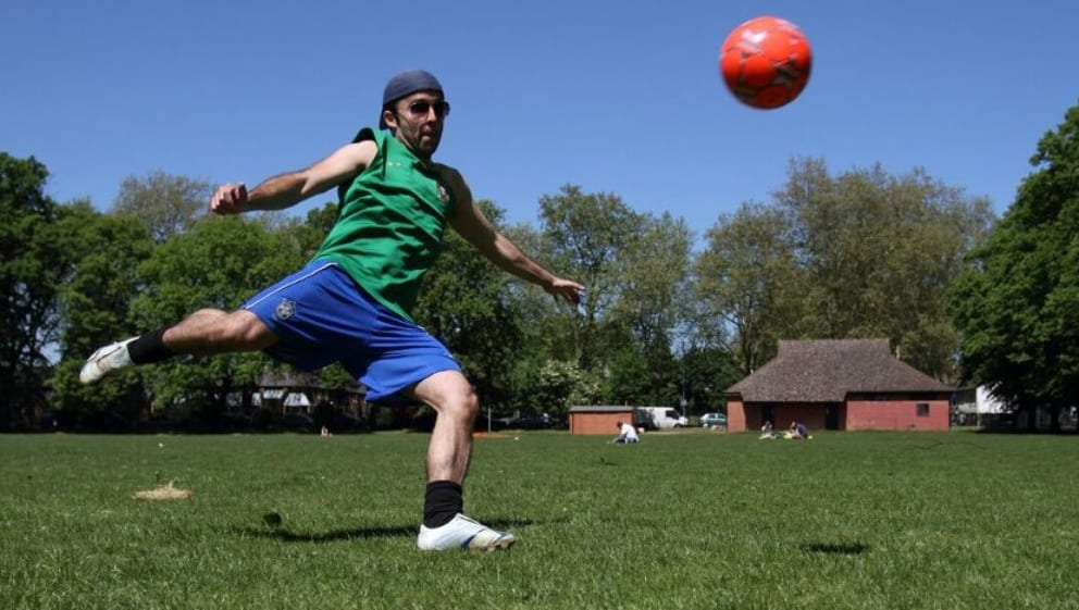 Ricardo kicking a football