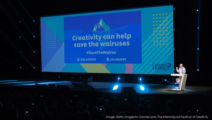 Alan Jope on stage at Cannes Lion: Back drop reads: Can Creativity Help Save the Walruses?