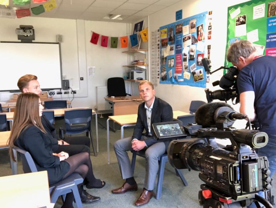 2019 winner Toby filming his news report at a local school.