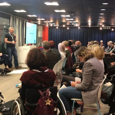 Three speakers address the audience at event