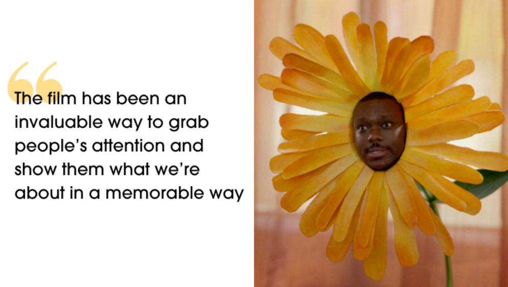 A yellow plant with a humans face. Next to it is a quote that says "The film has been an invaluable way to grab people’s attention and show them what we’re about in a memorable way."