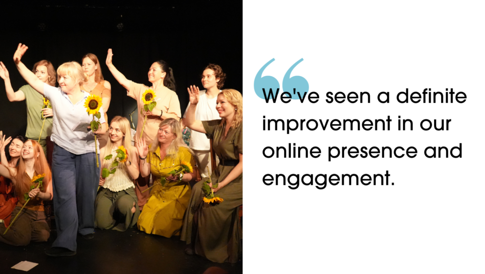 A group of people stood, sat and steeling on a stage. They are waving, smiling and holding sunflowers. "We've seen a definite improvement in our online presence and engagement."