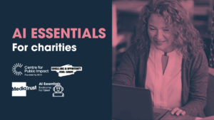 Pink and white text reading 'AI Essentials for charities' sits on the left hand side of the graphic, with a pink-tinted image of a woman smiling at her laptop on the right. The graphic background is dark blue/grey.