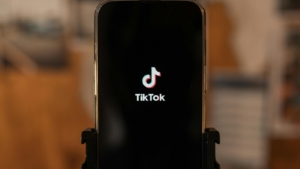 A mobile phone showing the TikTok logo