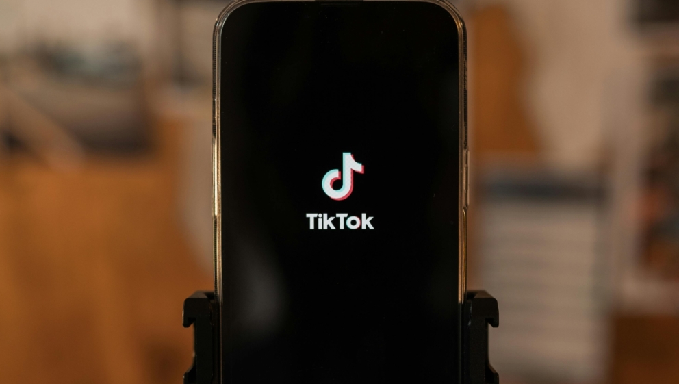 A mobile phone showing the TikTok logo