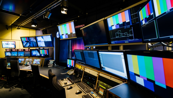 A TV production room, showing various screens and monitors
