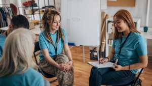 Four volunteers, sat talking