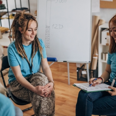 Four volunteers, sat talking