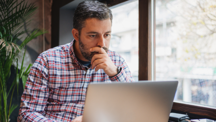 A person looking at a laptop