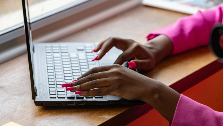 A person typing on a laptop